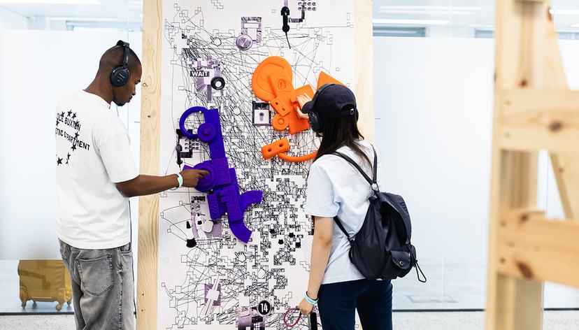 Visitors interacting with More Than a Swipe by Yuhan Zheng (Visual Communication) at RCA2026, credit ChrisLee copy