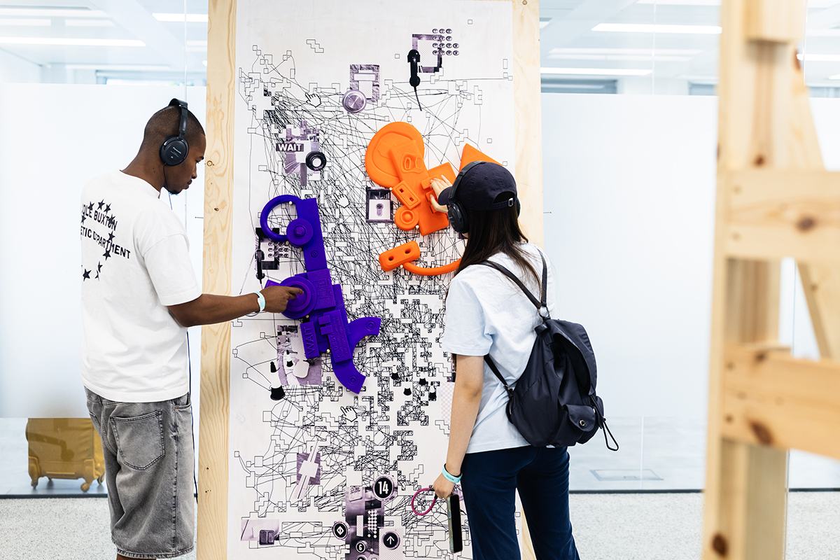Visitors interacting with More Than a Swipe by Yuhan Zheng (Visual Communication) at RCA2026, credit ChrisLee copy