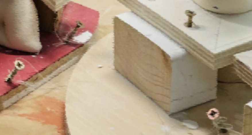 Blurry close up of construction and making detail, including wood and screws
