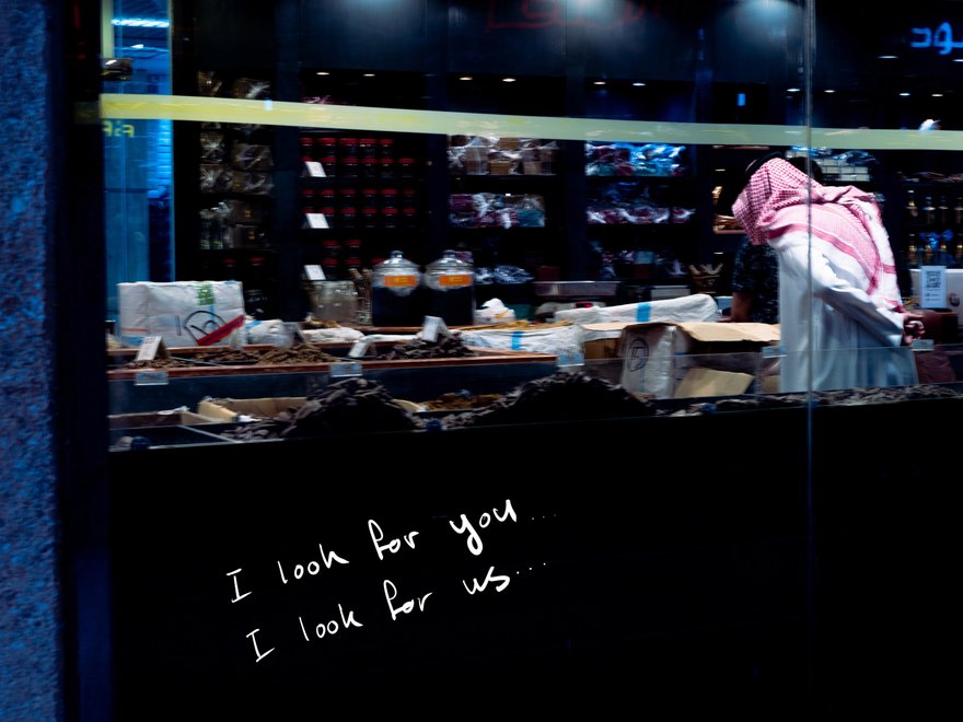 An image of the back of a man , with the words I look for you, I look for us