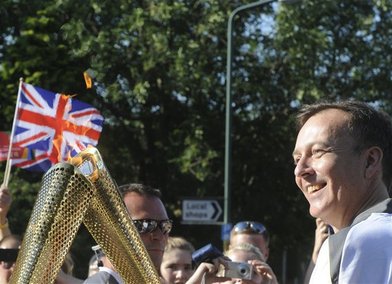 RCA Rector, Paul Thompson with the Olympic torch