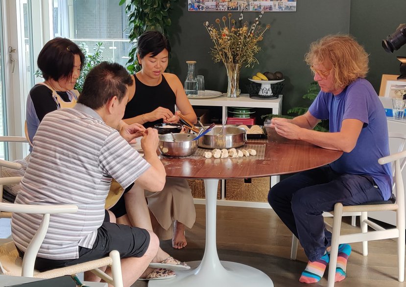 Dora, her parents and Grayson Perry being filmed making dumplings