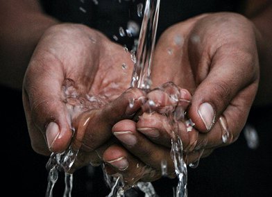Hands under water