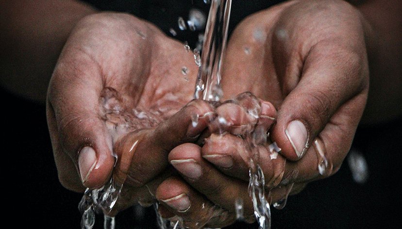 Hands under water