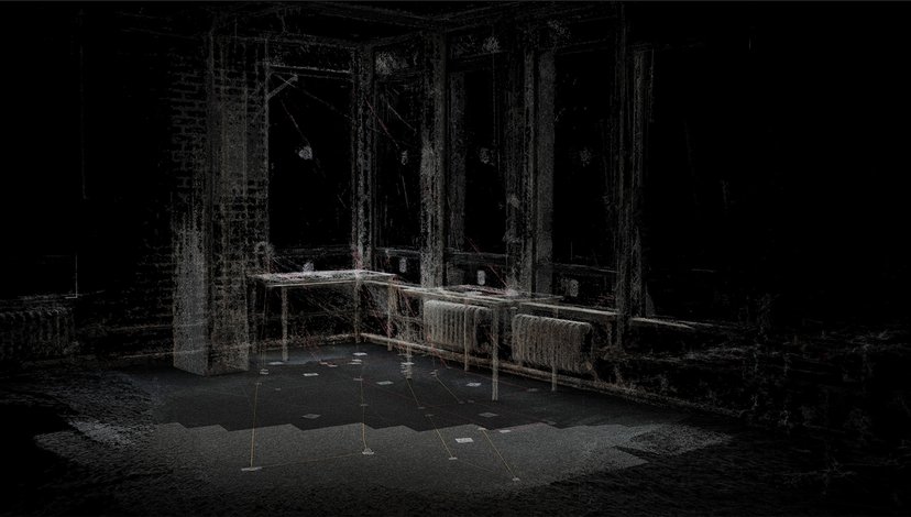 A dimly lit point cloud scan of a room with tall windows, tables, and radiators, showing a wireframe-like representation of the interior space.