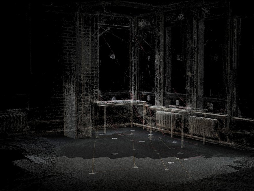 A dimly lit point cloud scan of a room with tall windows, tables, and radiators, showing a wireframe-like representation of the interior space.
