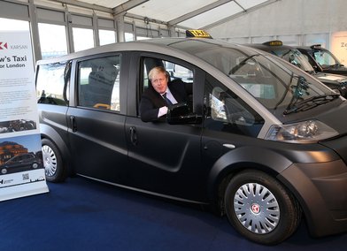 Boris Johnson, Mayor of London, takes the wheel of the RCA/Karsan taxi